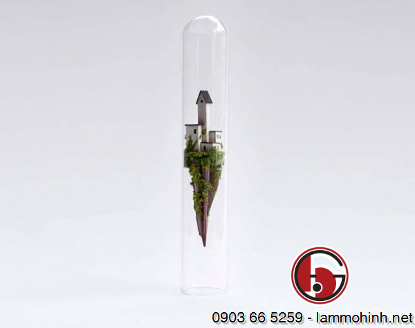 Các mô hình kiến trúc được thủ công tỉ mỉ từ một hỗn hợp chiết trung của các vật liệu như giấy, bìa cứng, cành cây và rêu Các mô hình kiến trúc được thủ công tỉ mỉ từ một hỗn hợp chiết trung của các vật liệu như giấy, bìa cứng, cành cây và rêu