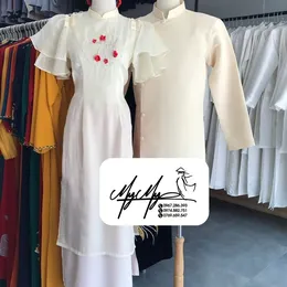 ÁO DÀI BƯNG QUẢ CẶP KEM HOA ĐỎ