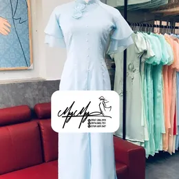 ÁO DÀI BƯNG QUẢ NỮ XANH XẺ TÀ