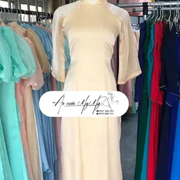 ÁO DÀI BƯNG QUẢ NỮ BE TAY LOE