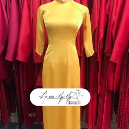 ÁO DÀI BƯNG QUẢ NỮ VÀNG TRUYỀN THỐNG