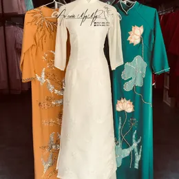 ÁO DÀI BƯNG QUẢ NỮ KEM TAY LOE NƠ