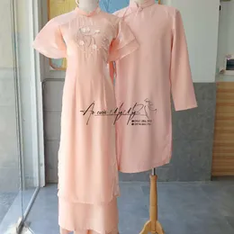ÁO DÀI BƯNG QUẢ CẶP HỒNG TAY CÁNH TIÊN