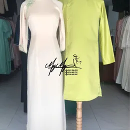 ÁO DÀI BƯNG QUẢ CẶP KEM PHỐI XANH ĐÍNH HOA