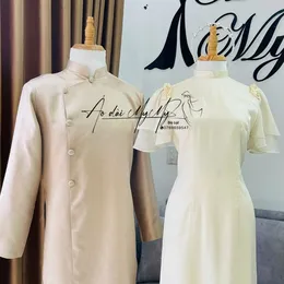 ÁO DÀI BƯNG QUẢ CẶP KEM CÁNH TIÊN VÀ BE GẤM