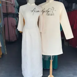 ÁO DÀI BƯNG QUẢ CẶP KEM TAY LOE