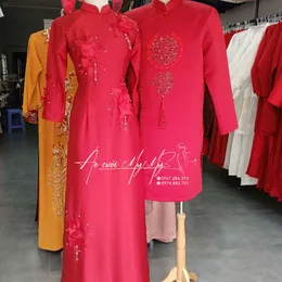 ÁO DÀI CẶP ĐỎ ĐÍNH KẾT HOA RƠI