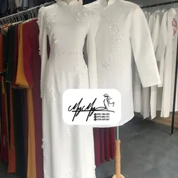 ÁO DÀI CẶP TRẮNG HOA XOAN VÀ PHA LÊ