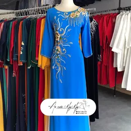 ÁO DÀI SUI XANH ĐÍNH KẾT HOA VÀNG