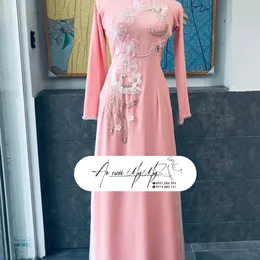 ÁO DÀI CÔ DÂU HỒNG ĐÍNH KẾT HOA VÀ PHƯỢNG HOÀNG
