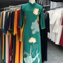ÁO DÀI SUI XANH KẾT HOA SEN VÀNG
