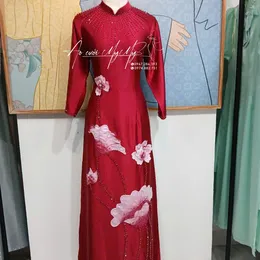 ÁO DÀI BÀ SUI ĐỎ ĐÍNH KẾT HOA SEN