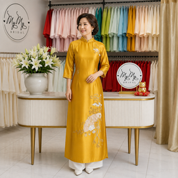 ÁO DÀI BÀ SUI VÀNG ĐÍNH KẾT CHIM HẠC VÀ QUẠT