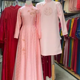 ÁO DÀI CƯỚI CẶP HỒNG ĐÍNH KẾT HOA PHA LÊ VÀ CHỮ HỶ
