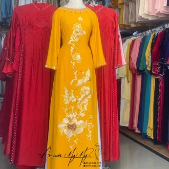 ÁO DÀI BÀ SUI VÀNG THÊU HOA VÀ CHIM HẠC