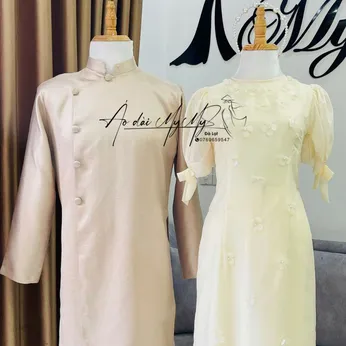 ÁO DÀI BƯNG QUẢ CẶP VÀNG TAY BỒNG KẾT HOA