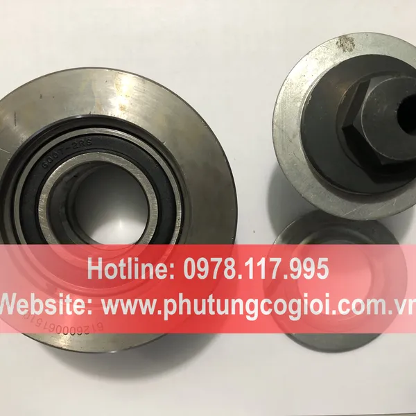 Puly tăng dây curoa máy xúc lật