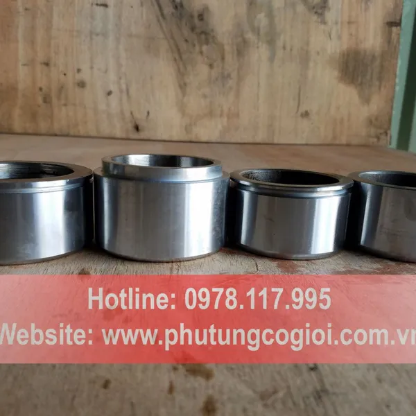 Pít tông phanh máy xúc lật