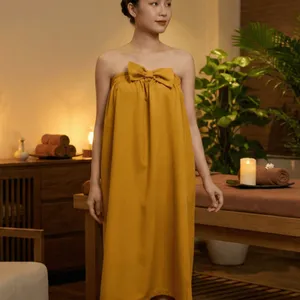 VÁY QUÂY SPA MÀU VÀNG CHO KHÁCH