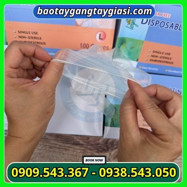 Găng tay vinyl trong suốt cổ tay bo chun chắc chắn Găng tay vinyl trong suốt