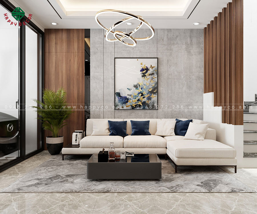 Phòng khách có tông màu trung tính và không gian mở, tạo không gian rộng rãi, thoáng mát