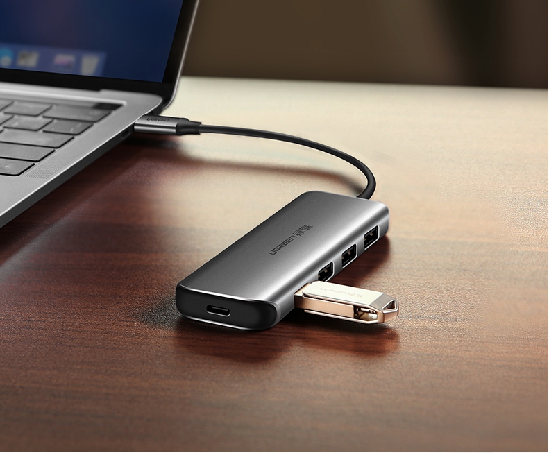 Bộ chia USB Type C ra 4 cổng USB 3.0 hỗ trợ cổng USB-C cấp nguồn Ugreen 50980 Bộ chia USB Type C ra 4 cổng USB 3.0 hỗ trợ cổng USB-C cấp nguồn Ugreen 50980