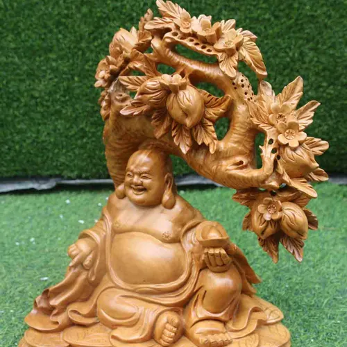 Di Lặc ngồi đào gỗ xá xị