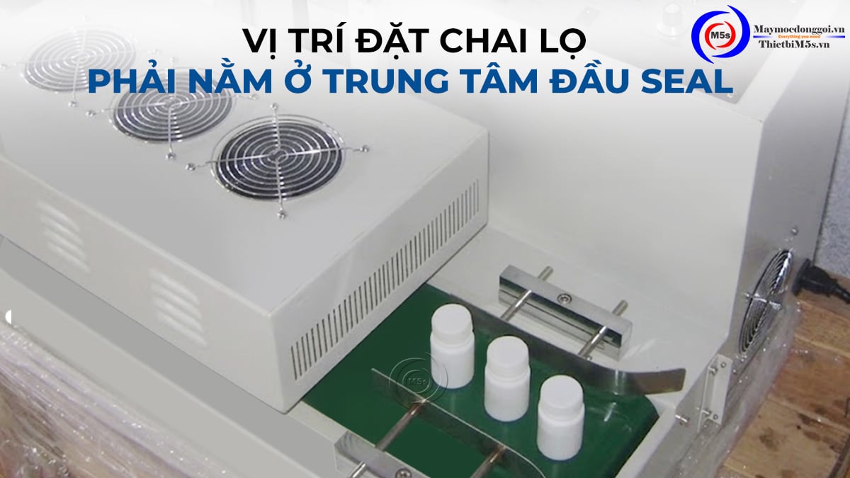 Vị trí đặt chai lọ máy dán màng seal nhôm Vị trí đặt chai lọ máy dán màng seal nhôm