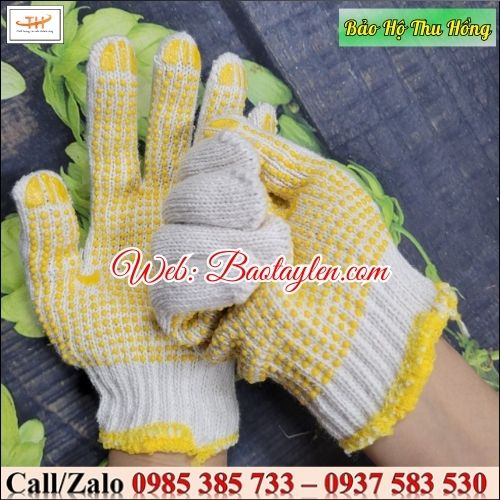 Găng tay len hạt nhựa bảo hộ lao động màu vàng. Găng tay len hạt nhựa bảo hộ lao động màu vàng.