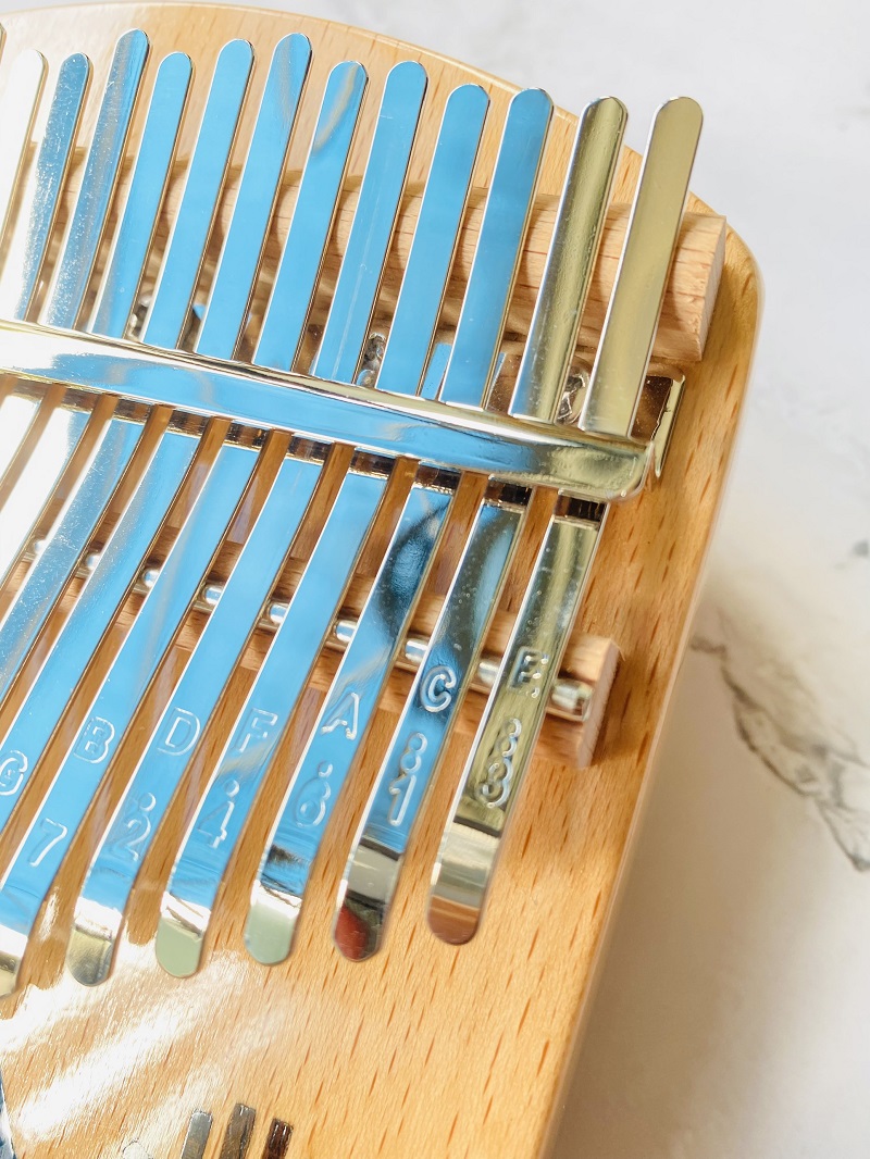 Đàn kalimba 21 phím Gỗ Nguyên Khối Cá Xanh Khảm Bo Góc Đàn kalimba 21 phím Gỗ Nguyên Khối Cá Xanh Khảm Bo Góc