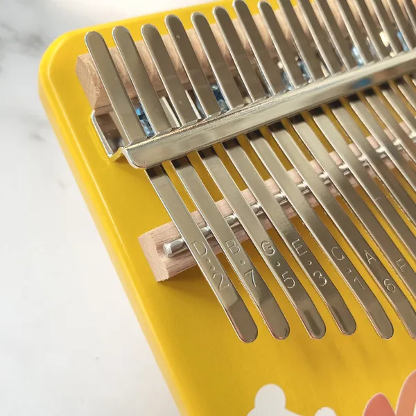 Đàn Kalimba 17 Phím Nguyên Khối Mahogany Cún Vàng KaLinh