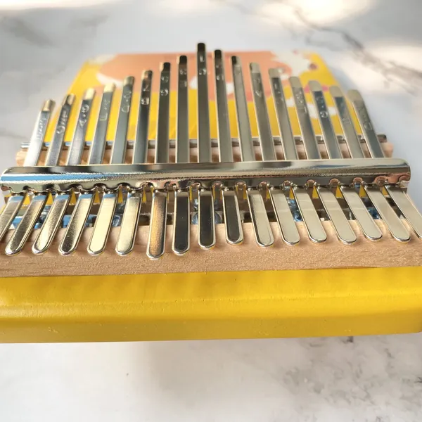 Đàn Kalimba 17 Phím Nguyên Khối Mahogany Cún Vàng KaLinh