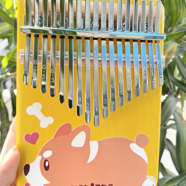Đàn Kalimba 17 Phím Nguyên Khối Mahogany Cún Vàng KaLinh