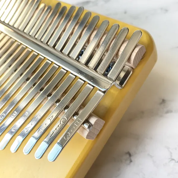 Đàn Kalimba 21 Phím Nguyên Khối Mahogany Cún Vàng KaLinh