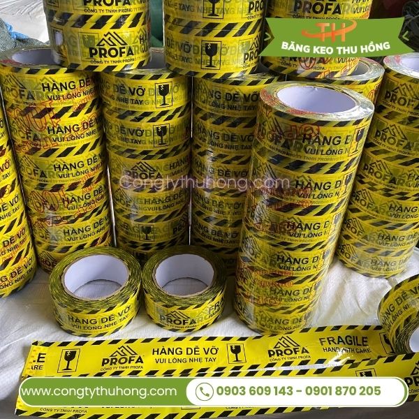 Băng keo in hàng dễ vỡ nền vàng Băng keo in hàng dễ vỡ nền vàng