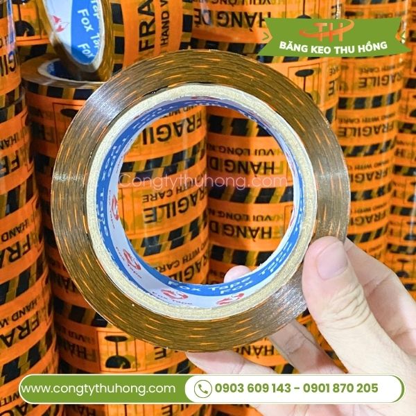 Băng keo in hàng dễ vỡ nền cam Băng keo in hàng dễ vỡ nền cam