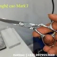 Sharpening chipped barber scissors with a high-tech grinding machine