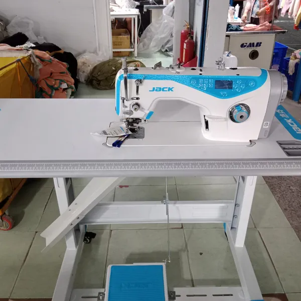 Máy 1 kim xén liền trục, đầu máy dầu khô, có cử bọc viền JACK JK-5558G-WT