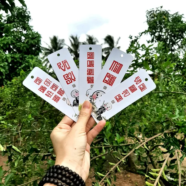 Thẻ bookmark Đánh Dấu Trang Hình Chú Tiểu Chibi Kèm Tua Rua Hoa Sen Chất Liệu Giấy Mỹ Thuật Cán Mờ 2 Mặt Kích Thước 4x12cm Phù Hợp Cho Học Tập Làm Việc Và Trang Trí Góc Làm Việc