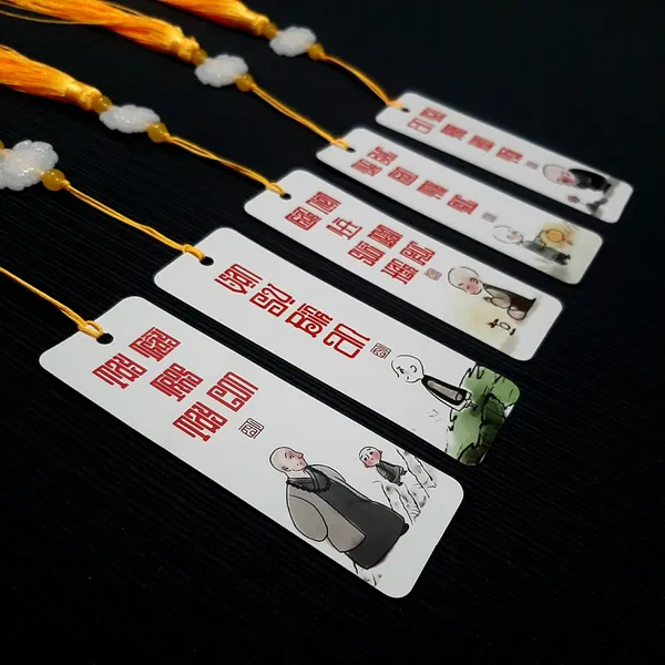 Thẻ bookmark Đánh Dấu Trang Hình Chú Tiểu Chibi Kèm Tua Rua Hoa Sen Chất Liệu Giấy Mỹ Thuật Cán Mờ 2 Mặt Kích Thước 4x12cm Phù Hợp Cho Học Tập Làm Việc Và Trang Trí Góc Làm Việc