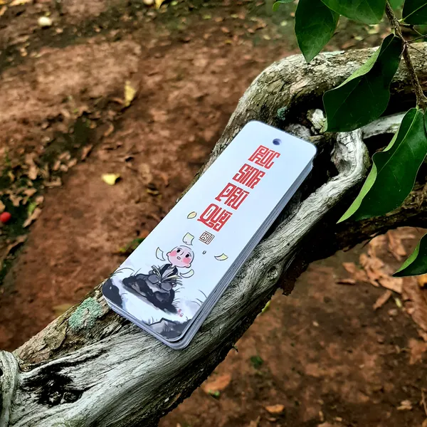 Thẻ bookmark Đánh Dấu Trang Hình Chú Tiểu Chibi Kèm Tua Rua Hoa Sen Chất Liệu Giấy Mỹ Thuật Cán Mờ 2 Mặt Kích Thước 4x12cm Phù Hợp Cho Học Tập Làm Việc Và Trang Trí Góc Làm Việc