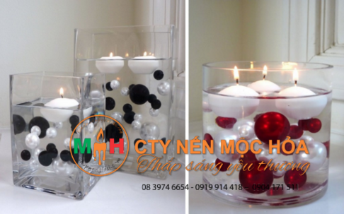 Bạn hãy thả cả một chuỗi ngọc xuống nước, thêm vào đó ít nhất 2 chiếc nến nổi vào ly thủy tinh để làm chìm ngọc trai Bạn hãy thả cả một chuỗi ngọc xuống nước, thêm vào đó ít nhất 2 chiếc nến nổi vào ly thủy tinh để làm chìm ngọc trai