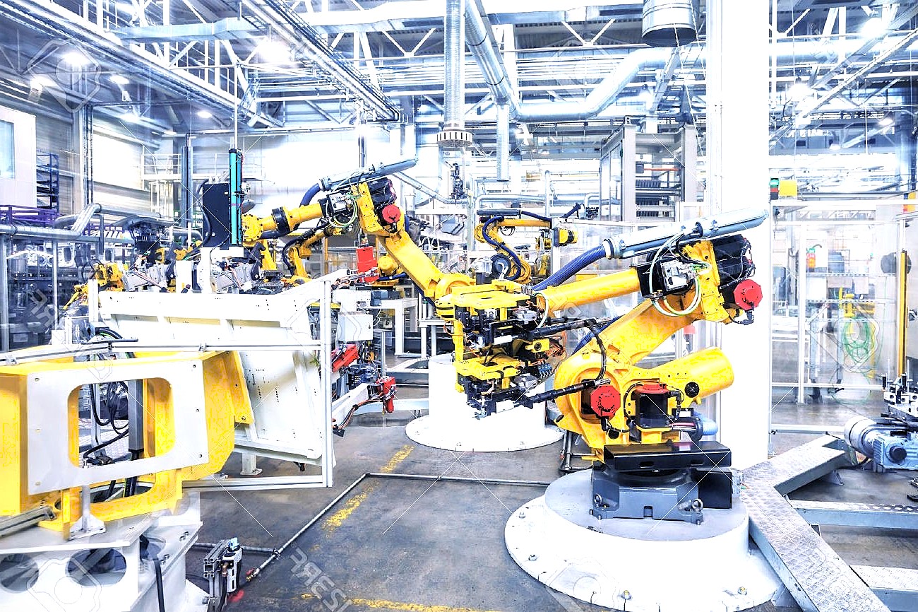 Kỹ sư cơ khí làm việc với robot trong nhà máy Kỹ sư cơ khí làm việc với robot trong nhà máy