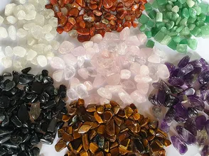 Colored quartz rocks scattered aquarium