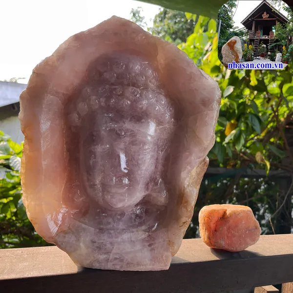 Sculpture of Shakyamuni Buddha”s face on rose quartz pebbles