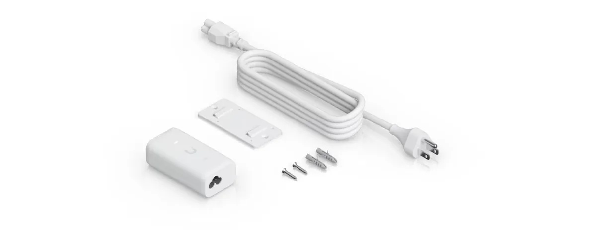 Trong hộp Bộ cấp nguồn PoE UniFi Gigabit 15W: bộ cấp nguồn, giá treo tường, dây nguồn AC và vít Trong hộp Bộ cấp nguồn PoE UniFi Gigabit 15W: bộ cấp nguồn, giá treo tường, dây nguồn AC và vít