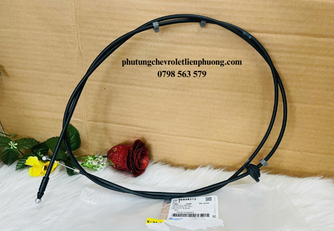 Cáp mở nắp capo Aveo kết nối giữa cần mở capo trong khoang lái và chốt khóa ở đầu xe Cáp mở nắp capo Aveo kết nối giữa cần mở capo trong khoang lái và chốt khóa ở đầu xe
