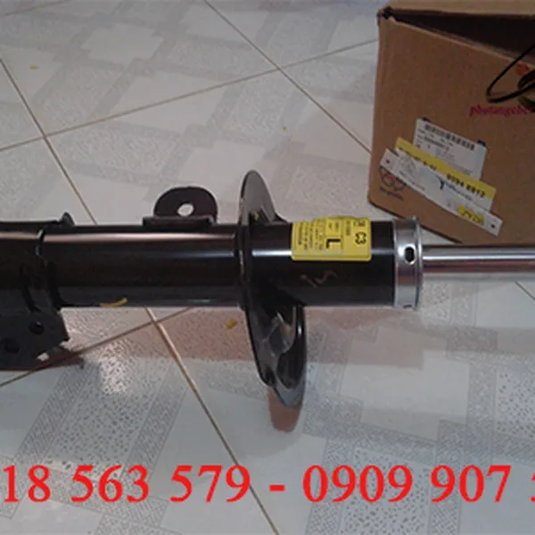 giảm xóc trước xe captiva