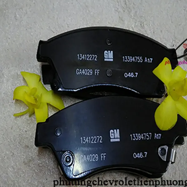 Má phanh trước xe cruze chính hãng