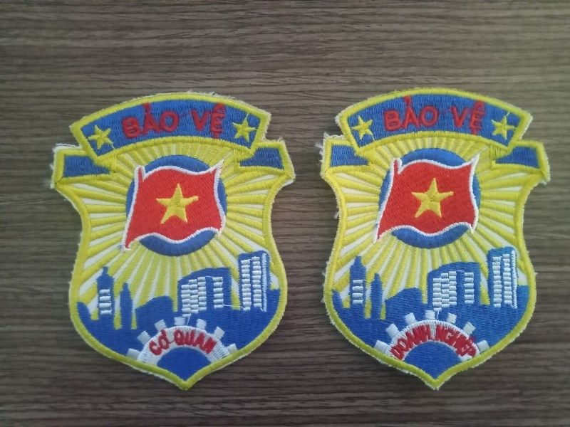 Mẫu logo thêu trên áo bảo vệ theo thông tư 8